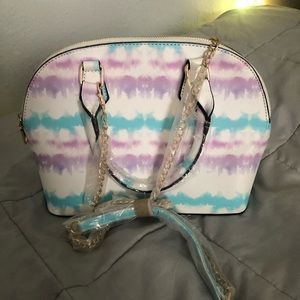 Never worn Beautiful purse with strap. Can be a cross body or shoulder strap.